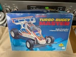 Vtg Radio Shack Turbo-buggy Master Rc 2-SPEED Racer W/remote & Box 60-4045 Work. Fixed Price $55.00.