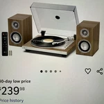 1 By One Fully Automatic Record Player, Repeat Function, Speakers, Remote. Fixed Price $225.00.