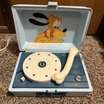 Vintage Pluto Player RP3124B Walt Disney Productions Plays Records. Fixed Price $75.00.